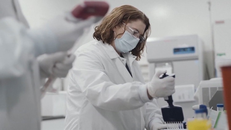 Microscopic view of personalized mRNA vaccine targeting melanoma cells, symbolizing hope