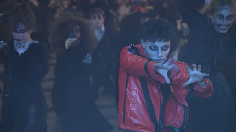 Crowd enjoying a Halloween flash mob performance in Hamburg, NY